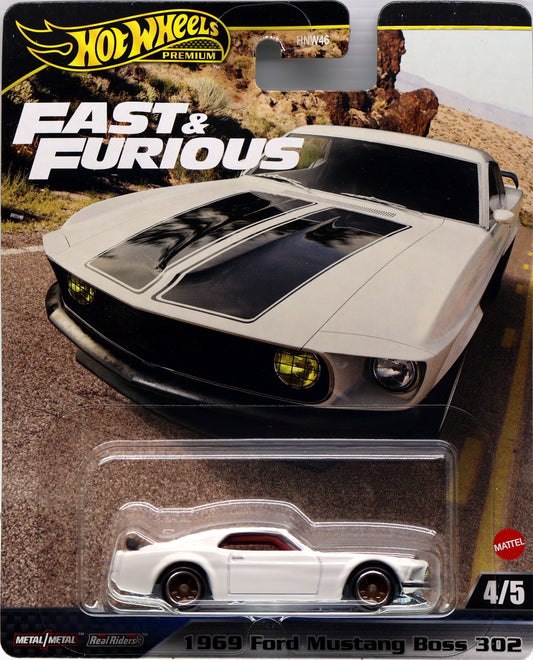 Image: Diecast model of a Ford Mustang Boss 302 from the Fast & Furious movie series, produced by Hot Wheels.  Alt text: "Diecast model of a Ford Mustang Boss 302 from Fast & Furious by Hot Wheels."  Shop now at tatoyshop.com.